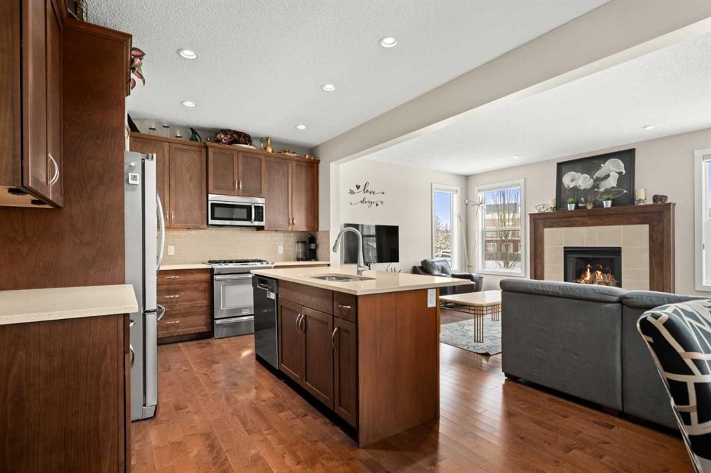 49 Evansview Manor Nw, Calgary, AB - Indoor Photo Showing Kitchen With Fireplace