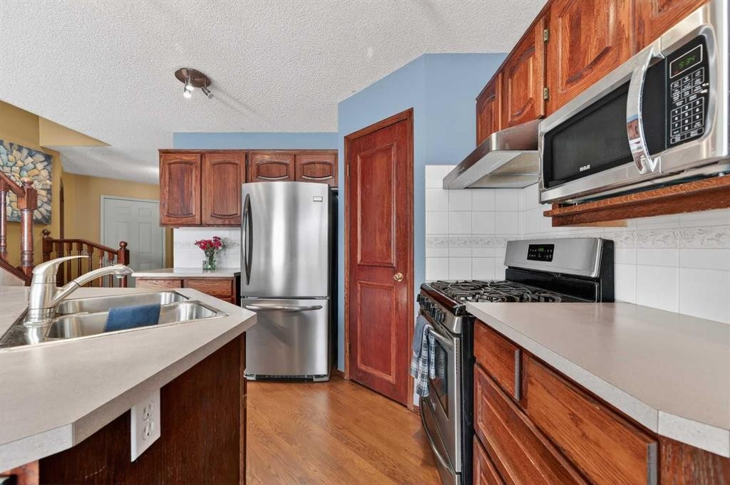 52 Riverwood Circle Se, Calgary, AB - Indoor Photo Showing Kitchen With Stainless Steel Kitchen With Double Sink