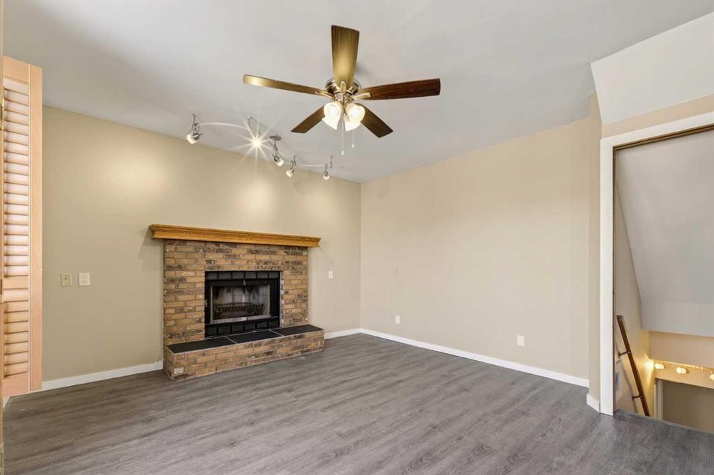 84 Rivergreen Crescent Se, Calgary, AB - Indoor Photo Showing Living Room With Fireplace