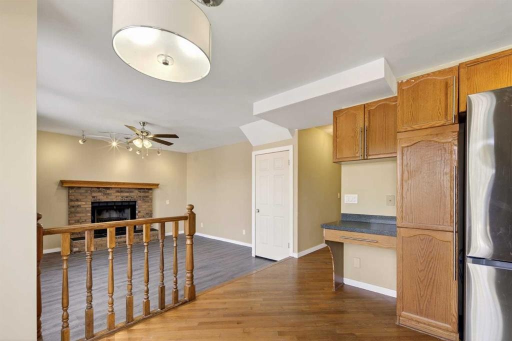 84 Rivergreen Crescent Se, Calgary, AB - Indoor With Fireplace