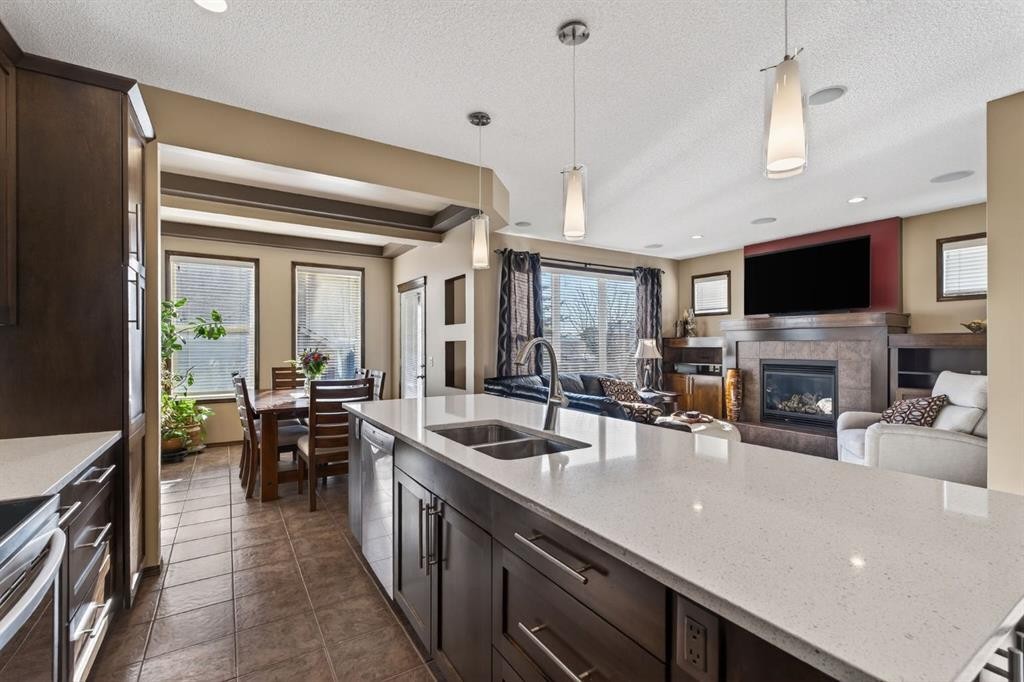 3 Pantego Avenue Nw, Calgary, AB - Indoor Photo Showing Kitchen With Fireplace With Double Sink With Upgraded Kitchen