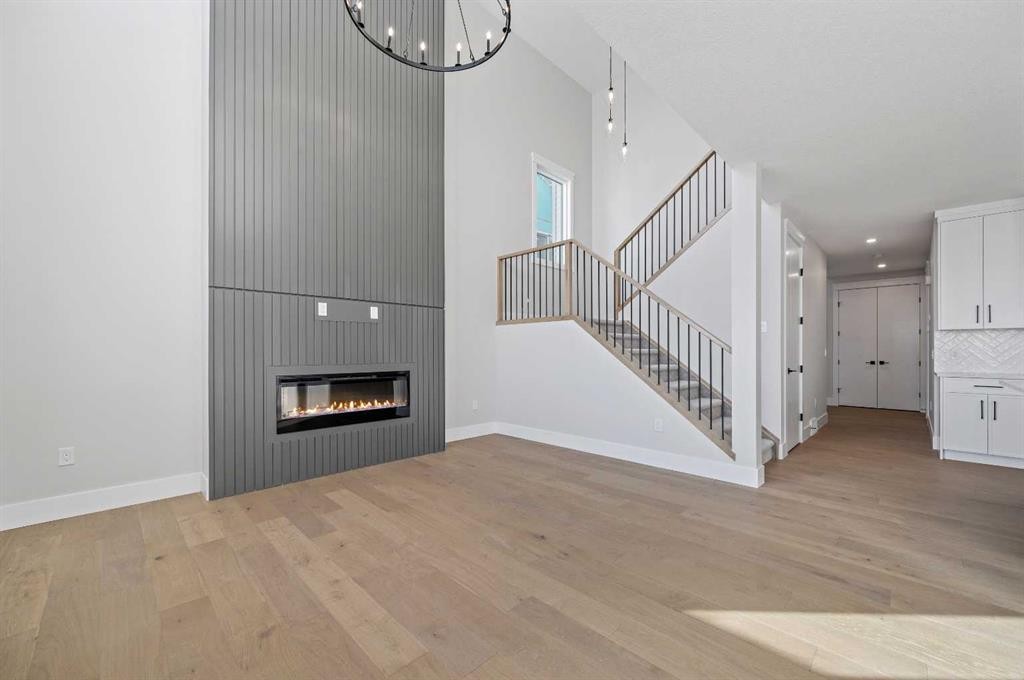 68 Heritage Ridge, Cochrane, AB - Indoor With Fireplace