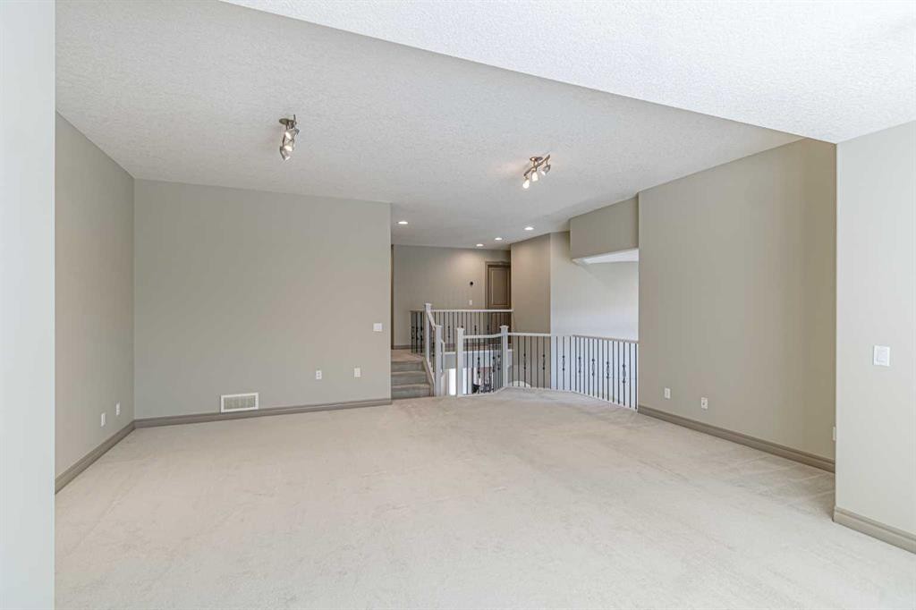 67 Evergreen Row Sw, Calgary, AB - Indoor Photo Showing Other Room