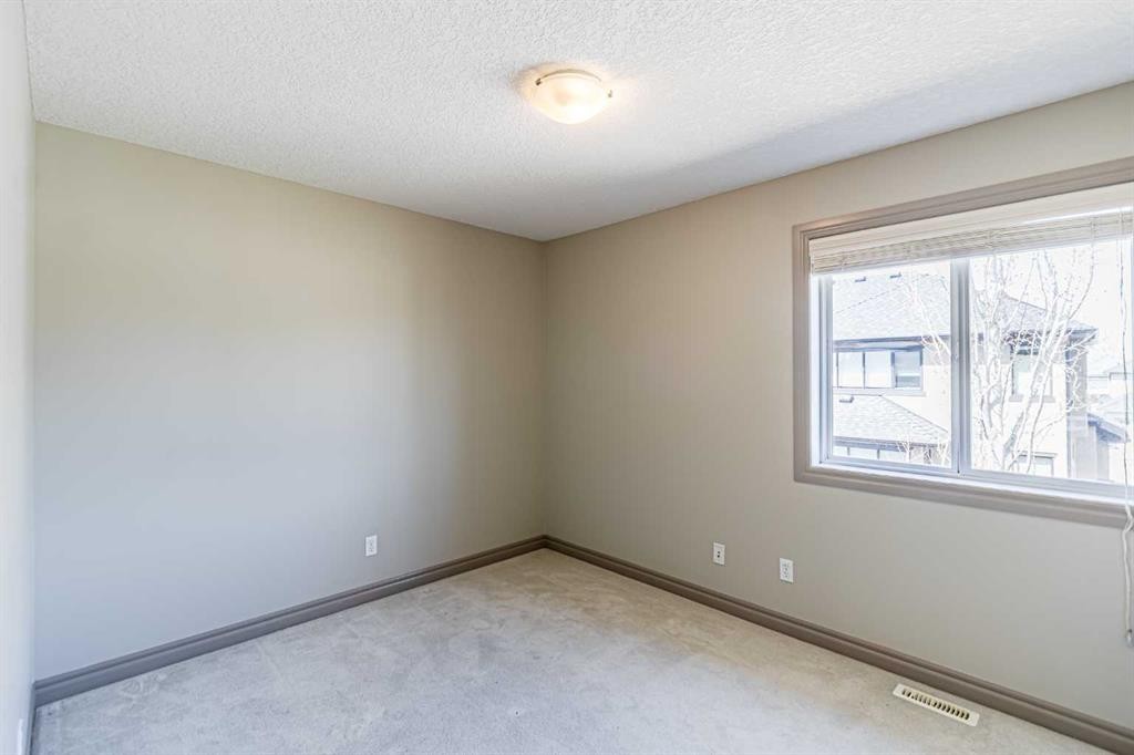 67 Evergreen Row Sw, Calgary, AB - Indoor Photo Showing Other Room