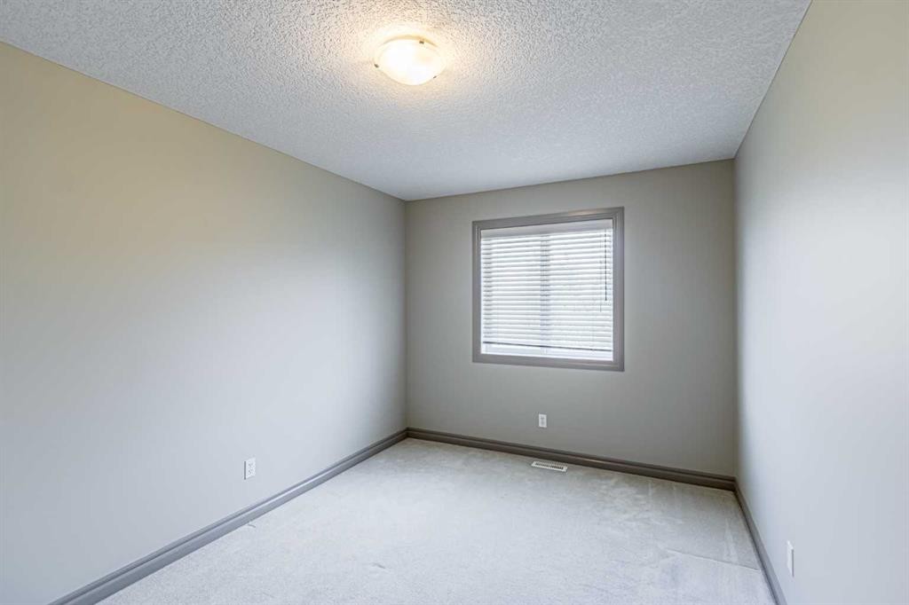67 Evergreen Row Sw, Calgary, AB - Indoor Photo Showing Other Room