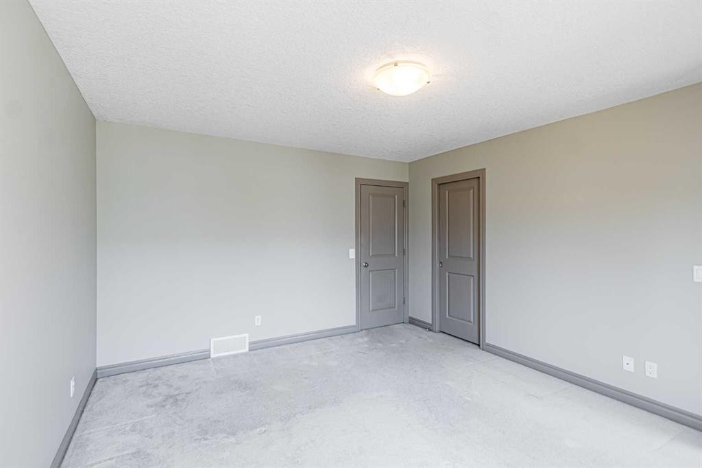 67 Evergreen Row Sw, Calgary, AB - Indoor Photo Showing Other Room