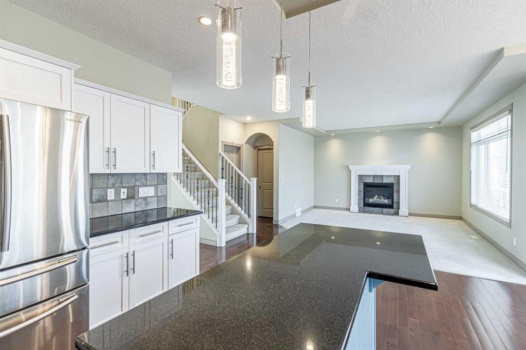 67 Evergreen Row Sw, Calgary, AB - Indoor With Fireplace
