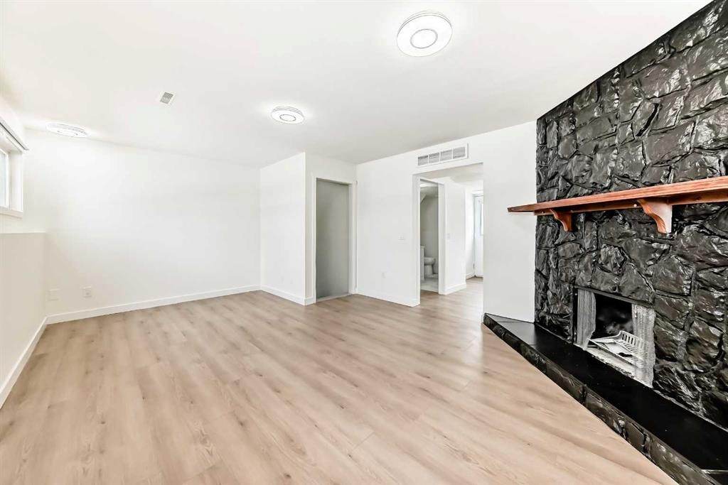 532 Rundleridge Drive Ne, Calgary, AB - Indoor Photo Showing Other Room With Fireplace