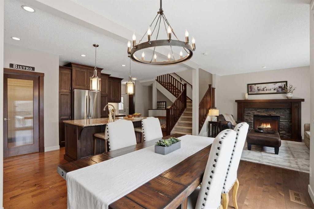 95 Cranarch Circle Se, Calgary, AB - Indoor Photo Showing Dining Room With Fireplace