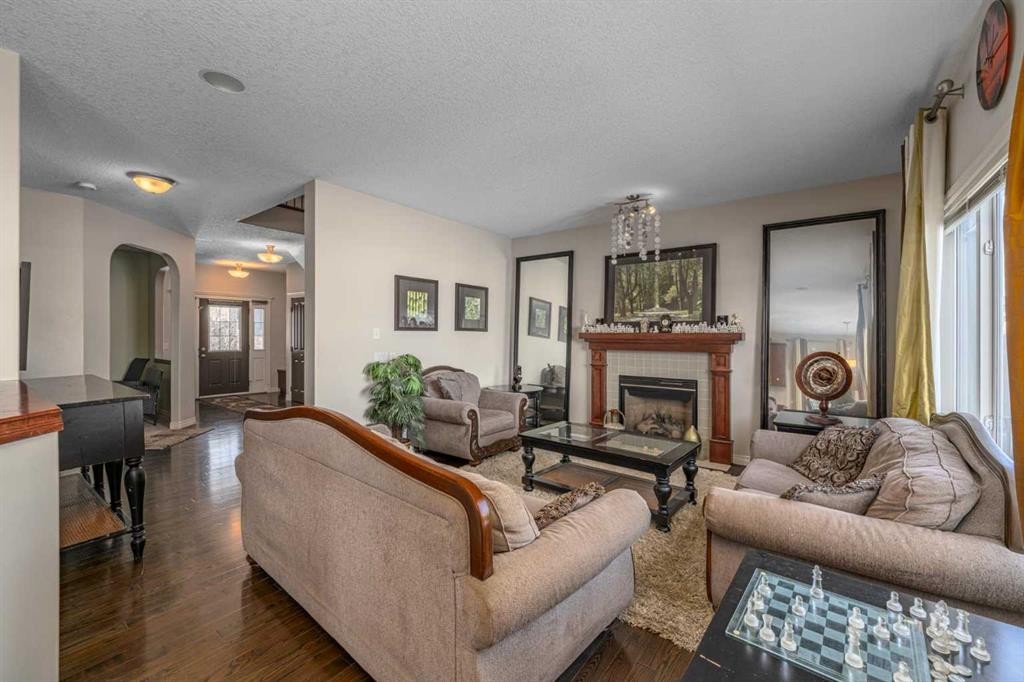32 Evanspark Circle Nw, Calgary, AB - Indoor Photo Showing Living Room With Fireplace