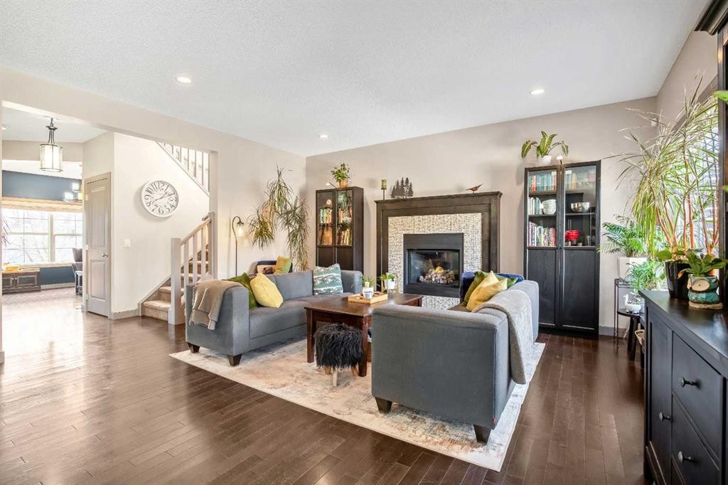 77 Elgin Meadows Manor Se, Calgary, AB - Indoor Photo Showing Living Room With Fireplace