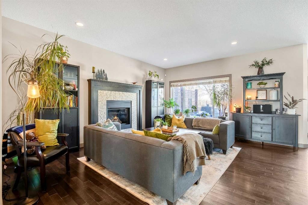 77 Elgin Meadows Manor Se, Calgary, AB - Indoor Photo Showing Living Room With Fireplace
