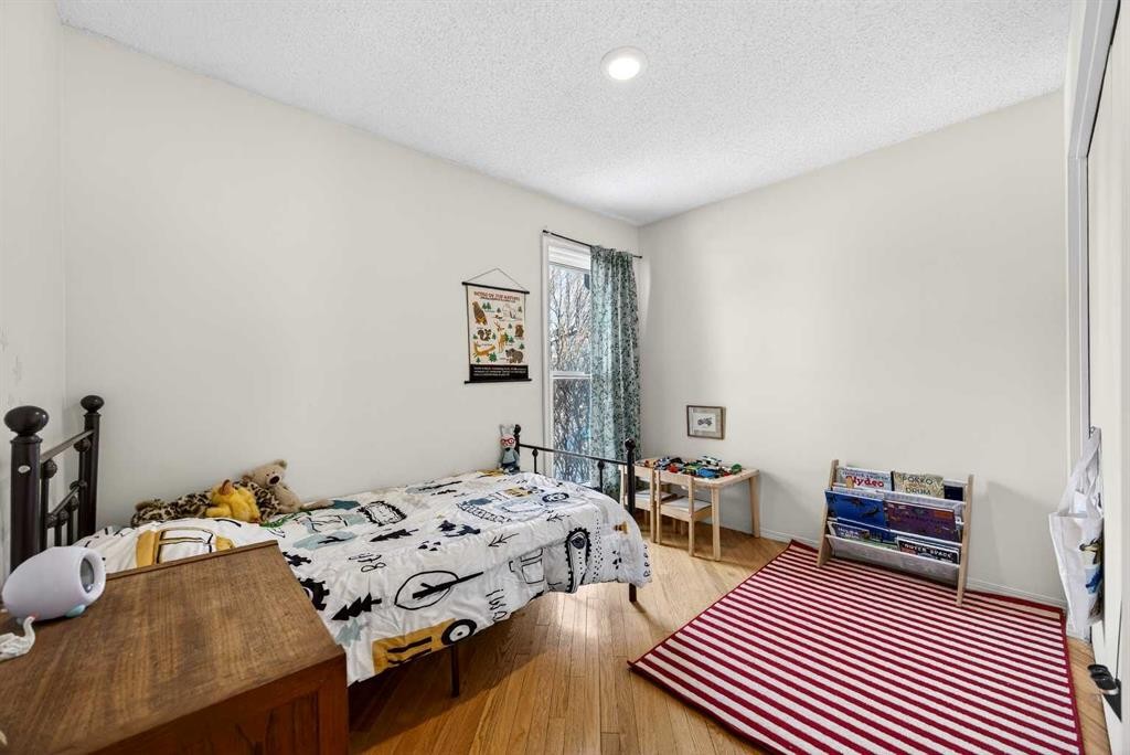 100 Strathcona Close Sw, Calgary, AB - Indoor Photo Showing Bedroom