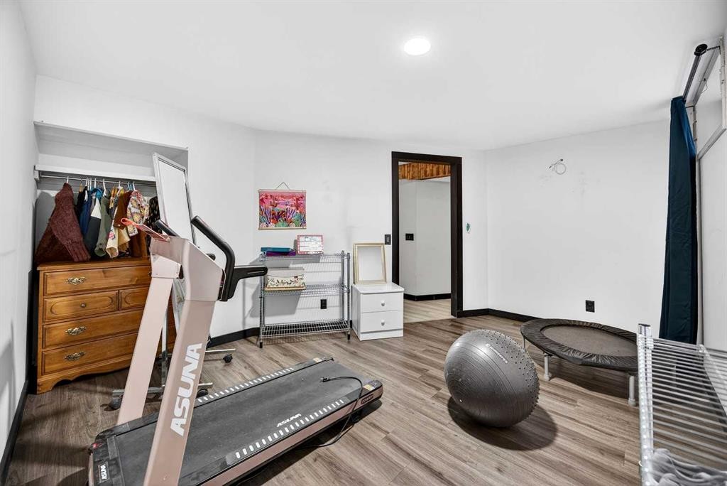 100 Strathcona Close Sw, Calgary, AB - Indoor Photo Showing Gym Room