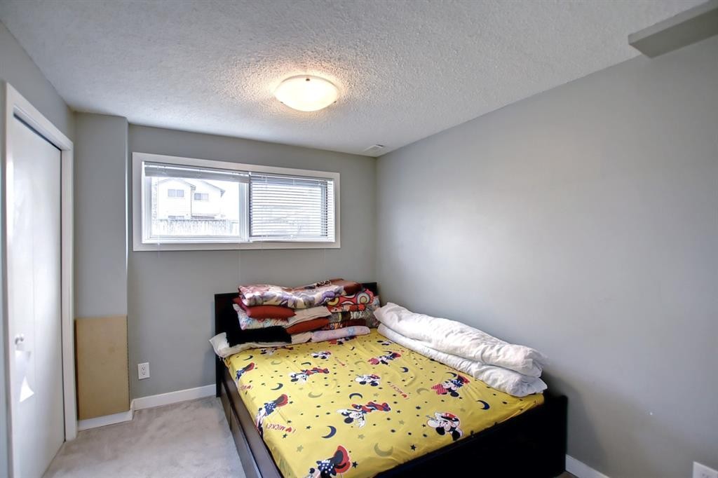 144 Whitmire Road Ne, Calgary, AB - Indoor Photo Showing Bedroom
