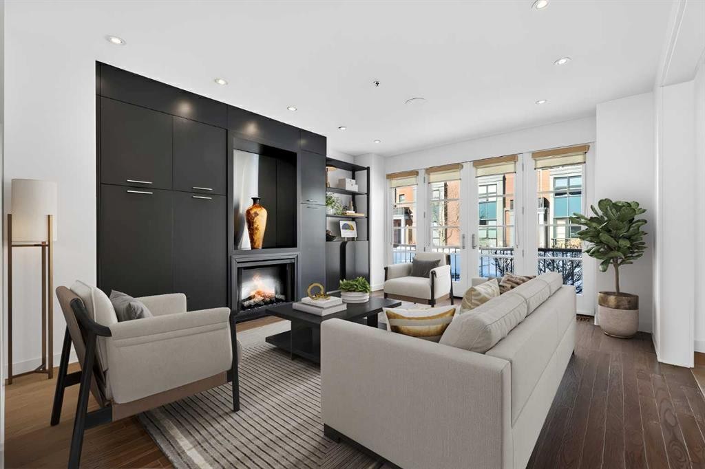 606 Aspen Meadows Hill Sw, Calgary, AB - Indoor Photo Showing Living Room With Fireplace
