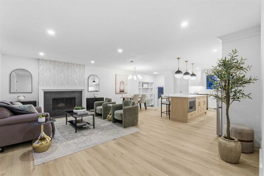 4904 Valiant Drive Nw, Calgary, AB - Indoor Photo Showing Living Room With Fireplace