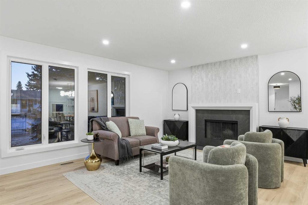 4904 Valiant Drive Nw, Calgary, AB - Indoor Photo Showing Living Room With Fireplace