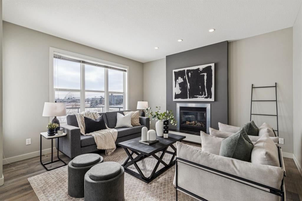 63 Copperstone Drive Se, Calgary, AB - Indoor Photo Showing Living Room With Fireplace