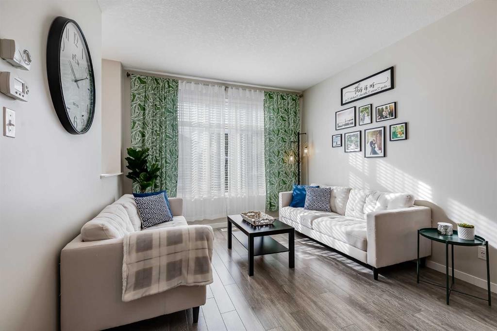 20 Copperpond Rise Se, Calgary, AB - Indoor Photo Showing Living Room