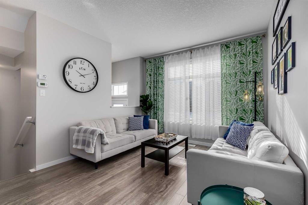 20 Copperpond Rise Se, Calgary, AB - Indoor Photo Showing Living Room