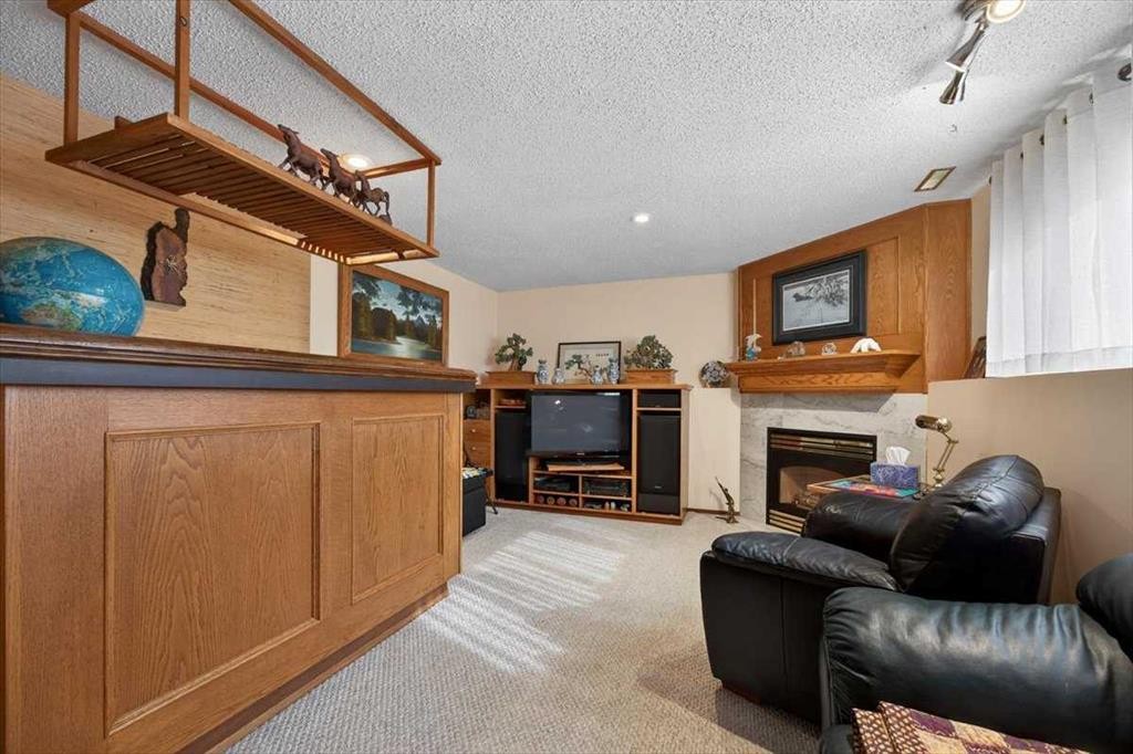 382 Ellis Crescent Se, High River, AB - Indoor With Fireplace