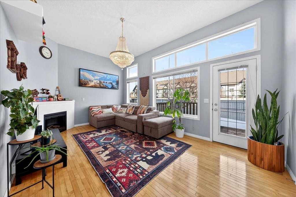 99 Copperfield Court Se, Calgary, AB - Indoor Photo Showing Living Room With Fireplace