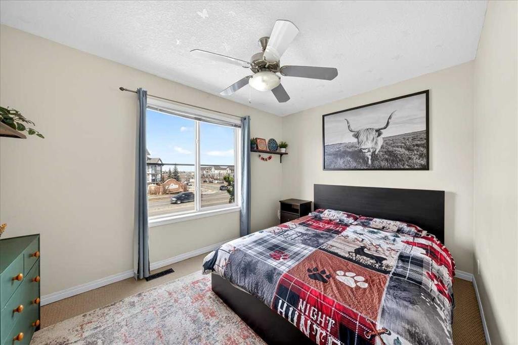 99 Copperfield Court Se, Calgary, AB - Indoor Photo Showing Bedroom