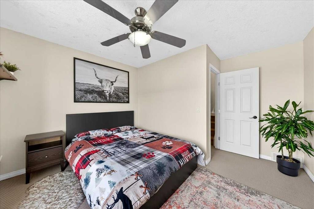 99 Copperfield Court Se, Calgary, AB - Indoor Photo Showing Bedroom