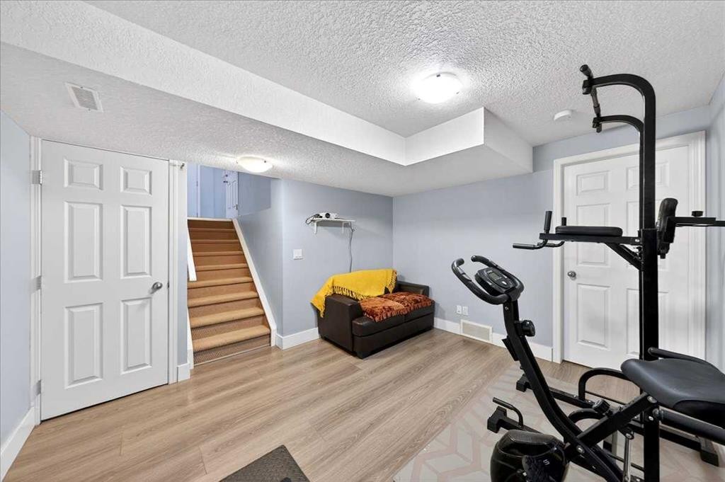 99 Copperfield Court Se, Calgary, AB - Indoor Photo Showing Gym Room
