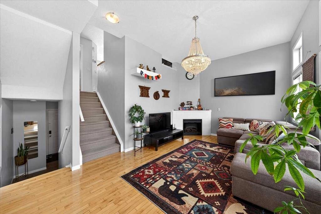 99 Copperfield Court Se, Calgary, AB - Indoor Photo Showing Living Room With Fireplace
