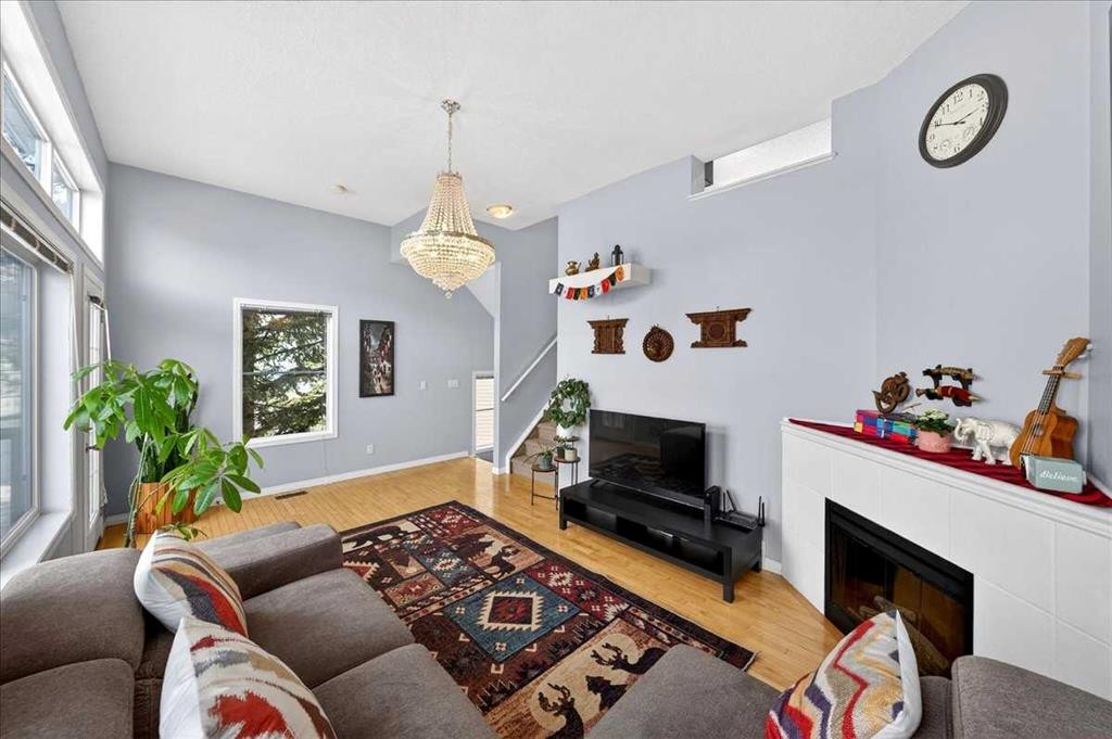 99 Copperfield Court Se, Calgary, AB - Indoor Photo Showing Living Room With Fireplace