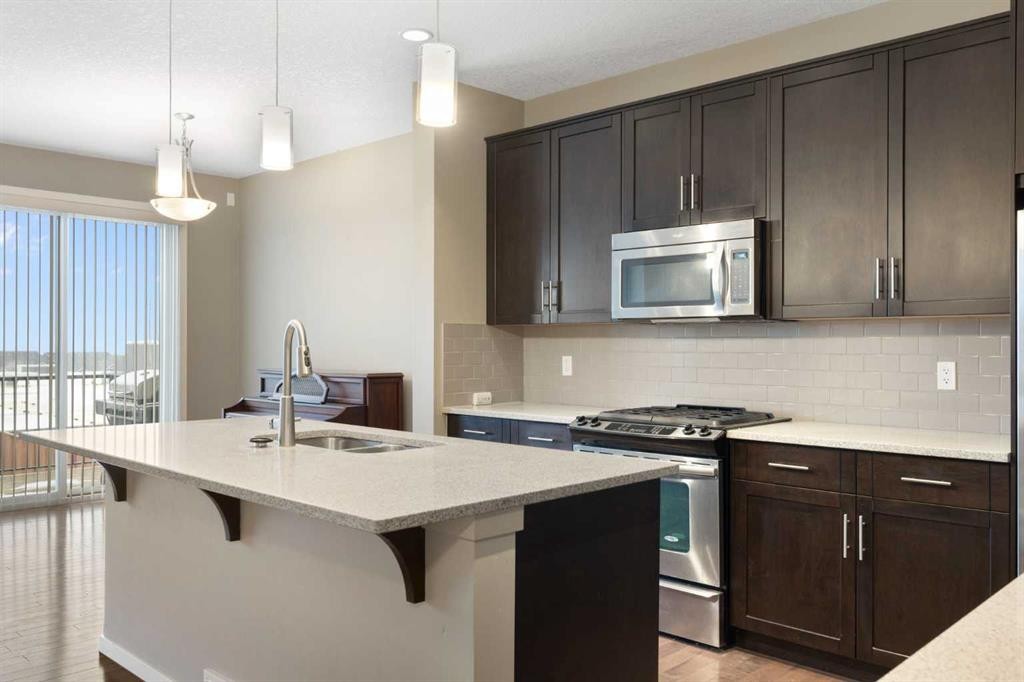 98 Nolanfield Road Nw, Calgary, AB - Indoor Photo Showing Kitchen With Double Sink With Upgraded Kitchen