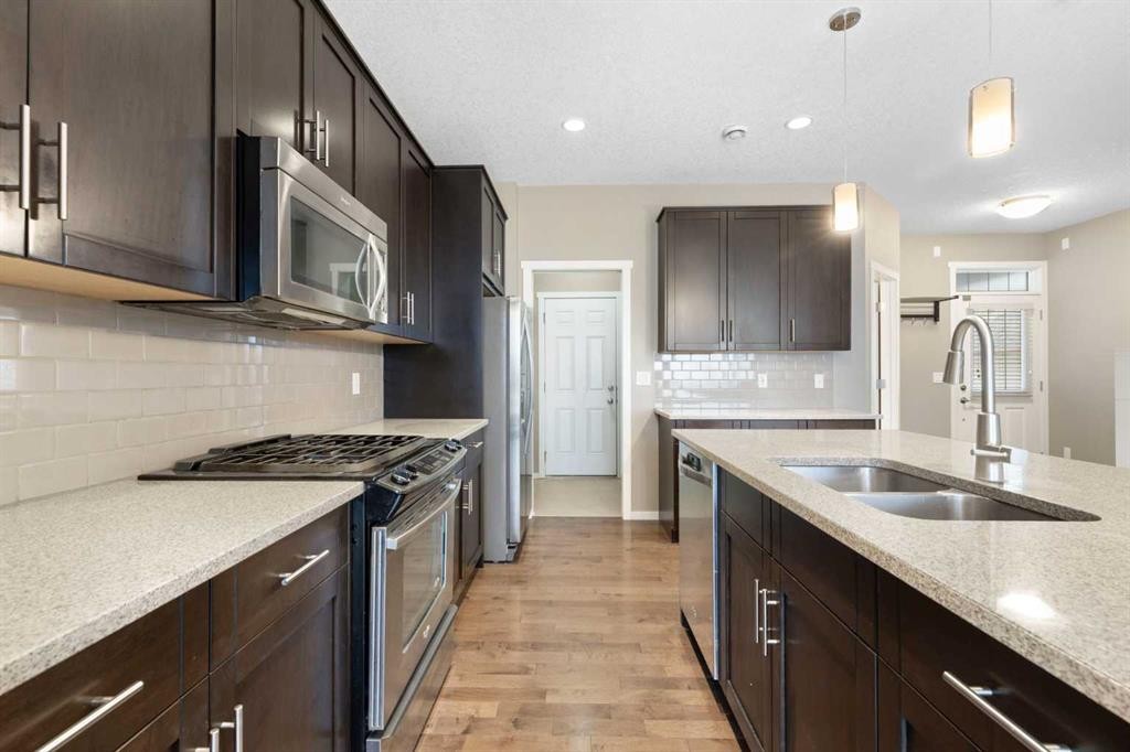 98 Nolanfield Road Nw, Calgary, AB - Indoor Photo Showing Kitchen With Double Sink With Upgraded Kitchen
