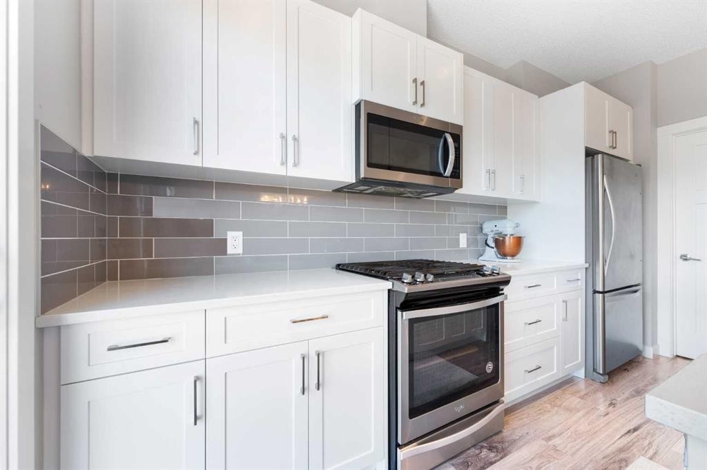 24 Seton Grove Se, Calgary, AB - Indoor Photo Showing Kitchen With Stainless Steel Kitchen With Upgraded Kitchen