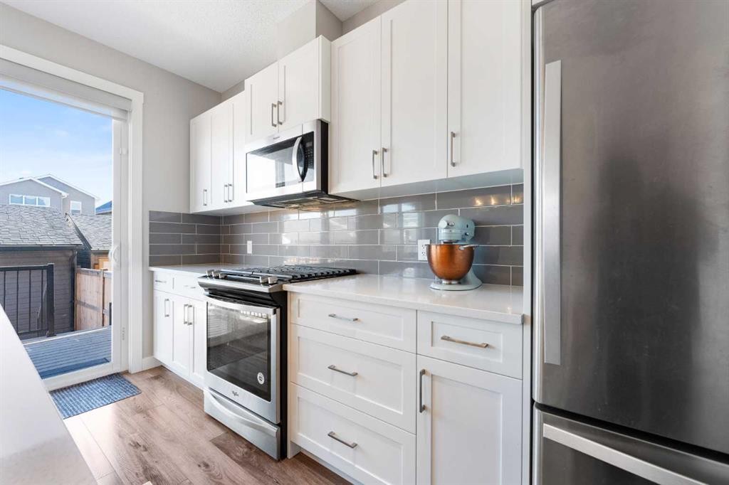 24 Seton Grove Se, Calgary, AB - Indoor Photo Showing Kitchen With Stainless Steel Kitchen