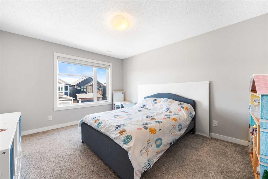 24 Seton Grove Se, Calgary, AB - Indoor Photo Showing Bedroom