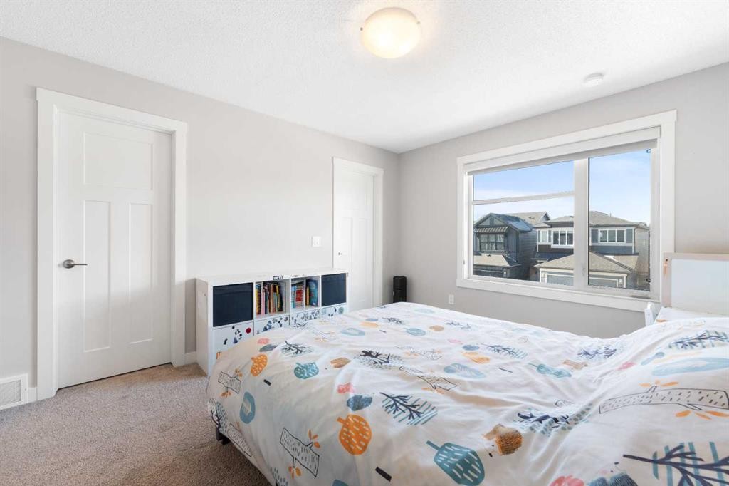 24 Seton Grove Se, Calgary, AB - Indoor Photo Showing Bedroom