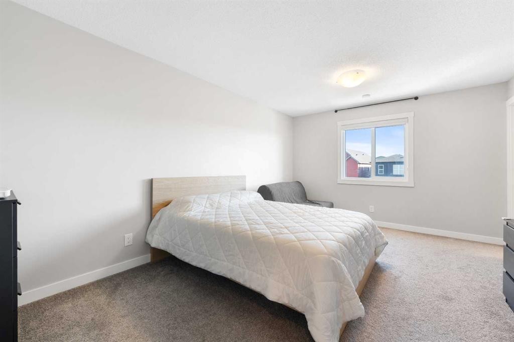 24 Seton Grove Se, Calgary, AB - Indoor Photo Showing Bedroom