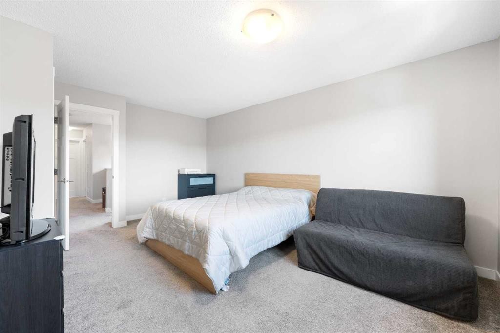 24 Seton Grove Se, Calgary, AB - Indoor Photo Showing Bedroom