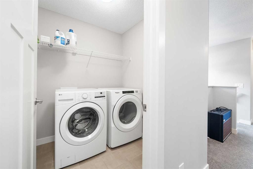 24 Seton Grove Se, Calgary, AB - Indoor Photo Showing Laundry Room