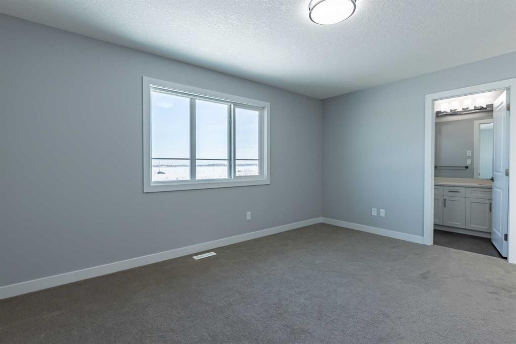 3 Heritage Point, Cochrane, AB - Indoor Photo Showing Other Room