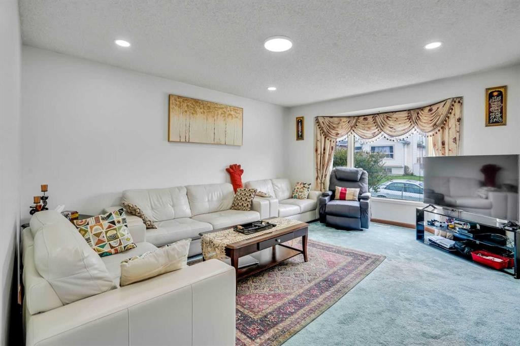 43 Falshire Close Ne, Calgary, AB - Indoor Photo Showing Living Room