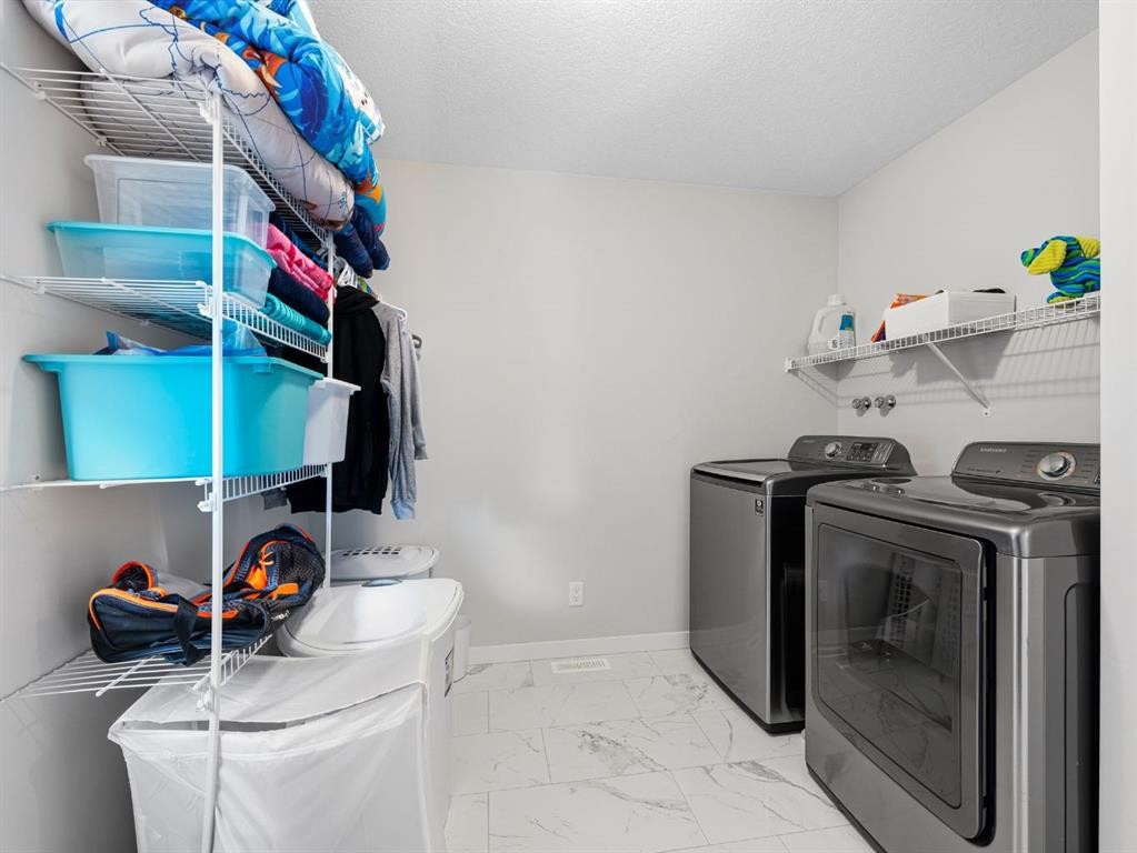 44 Masters Terrace Se, Calgary, AB - Indoor Photo Showing Laundry Room