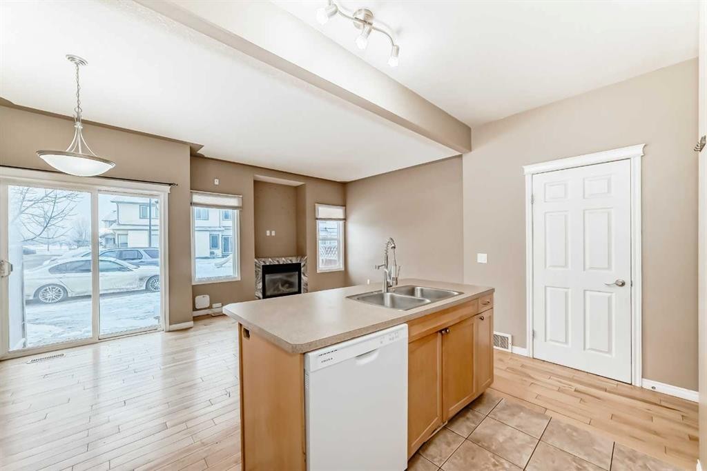 207-620 Luxstone Landing Sw, Airdrie, AB - Indoor Photo Showing Kitchen With Double Sink