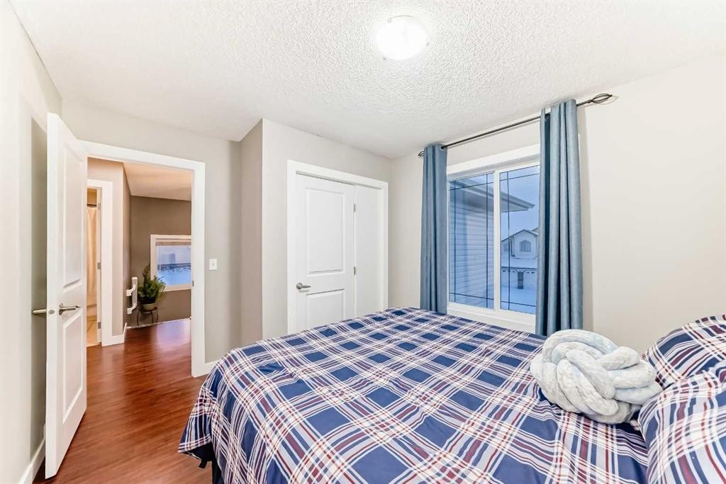 449 Sunset Link, Crossfield, AB - Indoor Photo Showing Bedroom