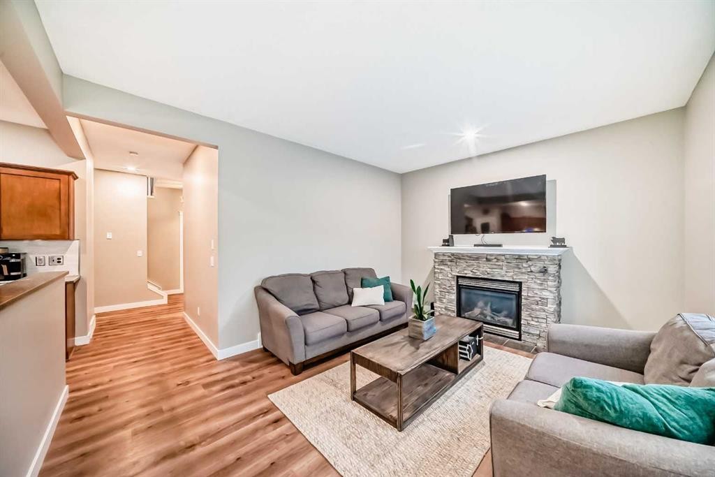 449 Sunset Link, Crossfield, AB - Indoor Photo Showing Living Room With Fireplace
