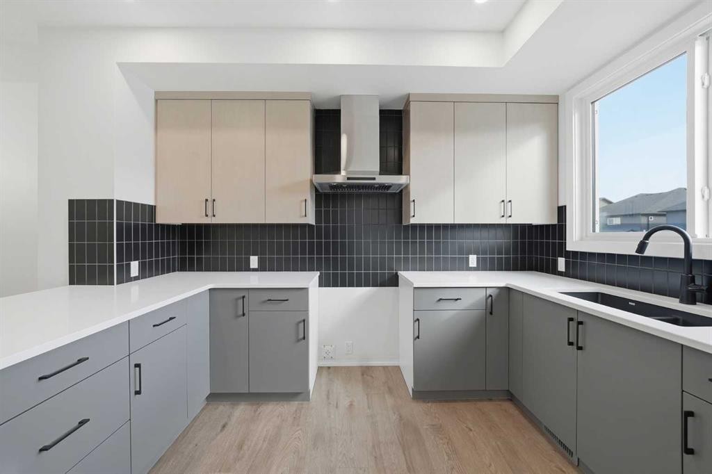 596 Buffaloberry Manor Se, Calgary, AB - Indoor Photo Showing Kitchen With Double Sink