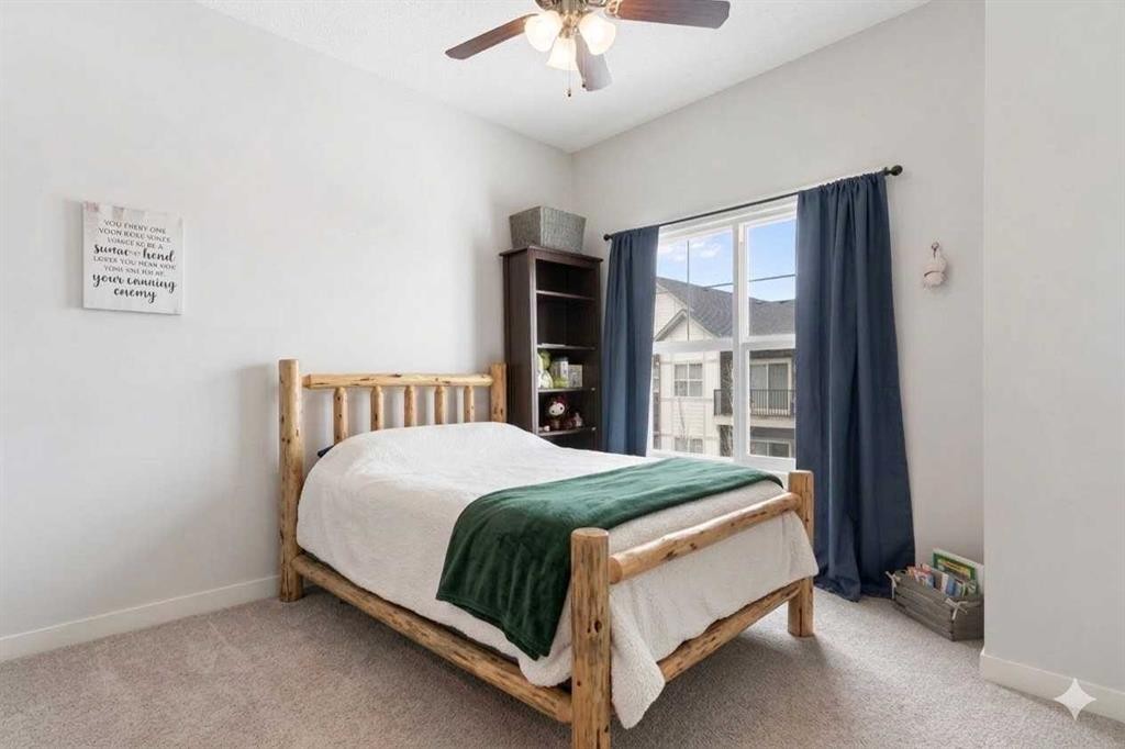 408-250 Fireside View, Cochrane, AB - Indoor Photo Showing Bedroom