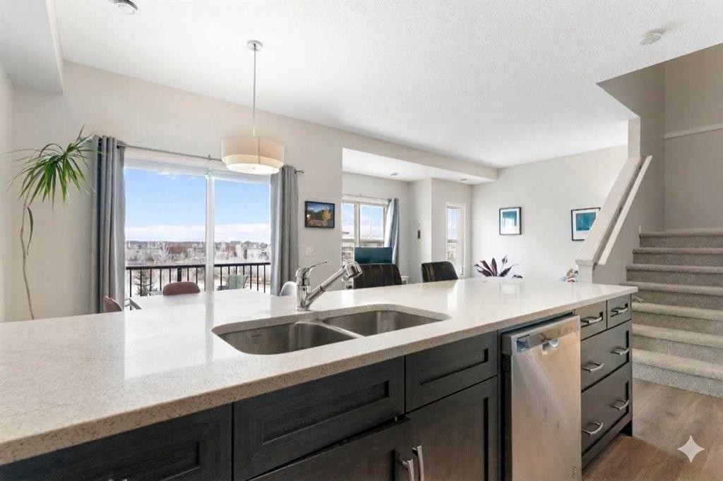408-250 Fireside View, Cochrane, AB - Indoor Photo Showing Kitchen With Double Sink